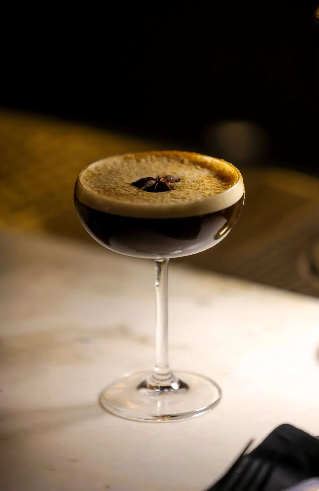 Espresso martini with crema on the marble bar